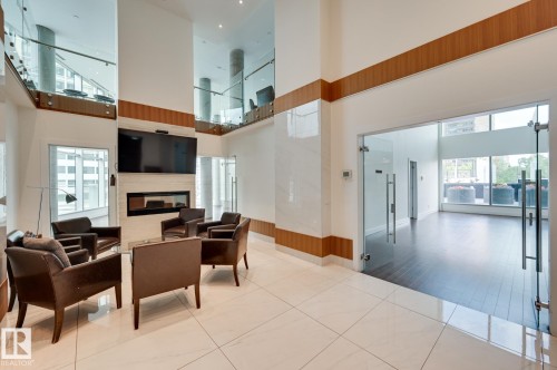 601 11969 Jasper Avenue, Edmonton, AB - Indoor Photo Showing Other Room With Fireplace