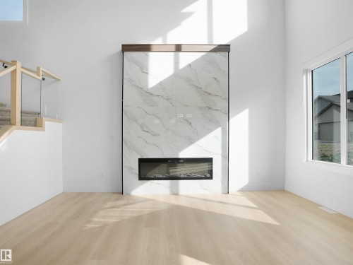 1113 Gyrfalcon Crescent, Edmonton, AB - Indoor With Fireplace
