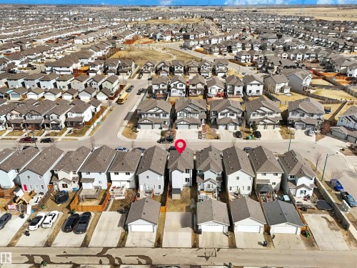 Aerial view of property and surrounding area featuring nearby suburban area - 1442 33A Street Nw, Edmonton, AB - Outdoor With Body Of Water With View
