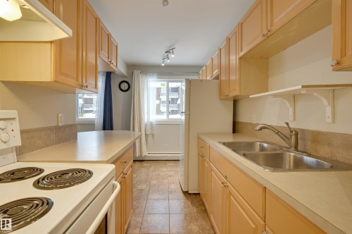 105 10621 79 Avenue, Edmonton, AB - Indoor Photo Showing Kitchen With Double Sink