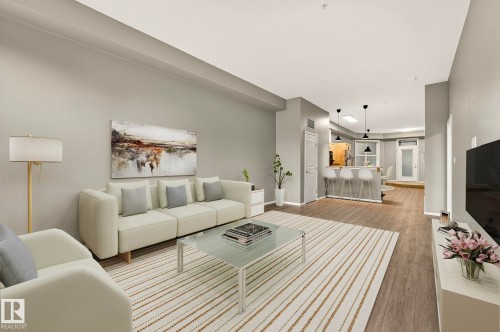 100 10531 117 Street, Edmonton, AB - Indoor Photo Showing Living Room