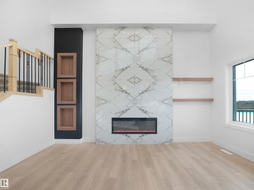 203 Crystal Creek Dr, Leduc, AB - Indoor Photo Showing Other Room With Fireplace