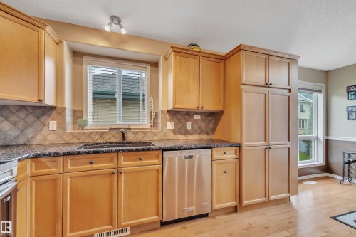 6 102 Bridgeport Crossing, Leduc, AB - Indoor Photo Showing Kitchen With Double Sink
