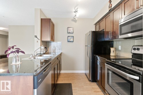 216 5390 Chappelle Road, Edmonton, AB - Indoor Photo Showing Kitchen With Double Sink