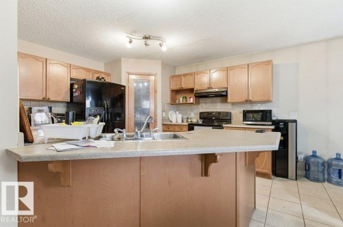 16228 48 Street, Edmonton, AB - Indoor Photo Showing Kitchen With Double Sink