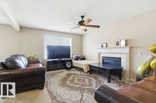 16228 48 Street, Edmonton, AB - Indoor Photo Showing Living Room With Fireplace