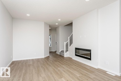 4297 Kinglet Drive, Edmonton, AB - Indoor Photo Showing Living Room With Fireplace