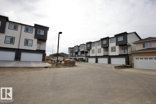 207 300 Awentia Drive, Leduc, AB - Outdoor With Facade