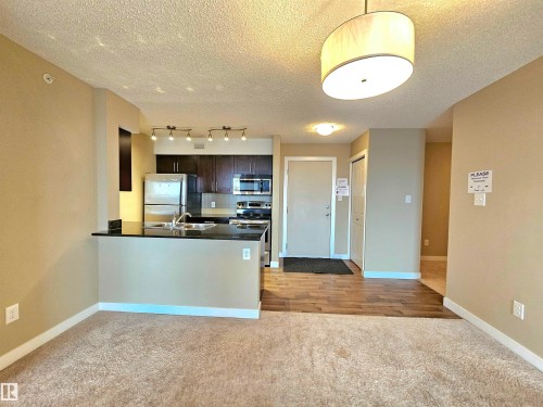 406 1080 Mcconachie Boulevard, Edmonton, AB - Indoor Photo Showing Kitchen With Double Sink