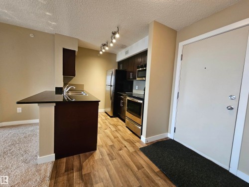 406 1080 Mcconachie Boulevard, Edmonton, AB - Indoor Photo Showing Kitchen With Double Sink