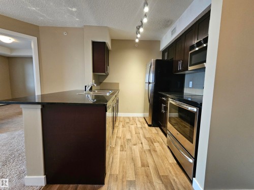 406 1080 Mcconachie Boulevard, Edmonton, AB - Indoor Photo Showing Kitchen With Double Sink