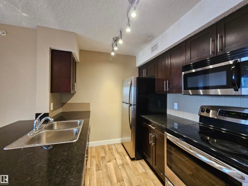 406 1080 Mcconachie Boulevard, Edmonton, AB - Indoor Photo Showing Kitchen With Stainless Steel Kitchen With Double Sink
