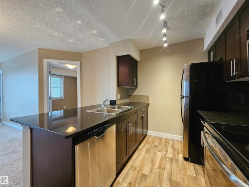 406 1080 Mcconachie Boulevard, Edmonton, AB - Indoor Photo Showing Kitchen With Stainless Steel Kitchen With Double Sink
