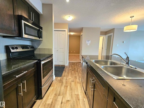 406 1080 Mcconachie Boulevard, Edmonton, AB - Indoor Photo Showing Kitchen With Stainless Steel Kitchen With Double Sink