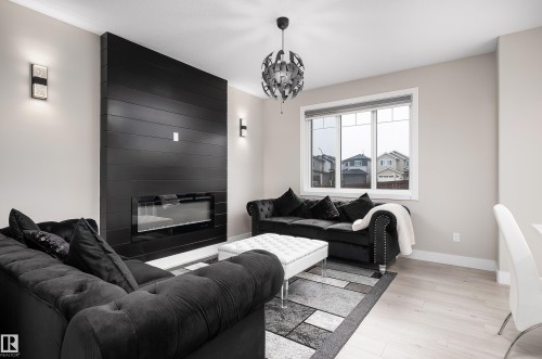 23 Hunter Place, Spruce Grove, AB - Indoor Photo Showing Living Room With Fireplace