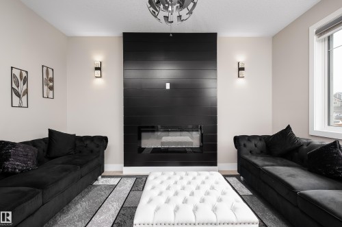 23 Hunter Place, Spruce Grove, AB - Indoor Photo Showing Living Room With Fireplace