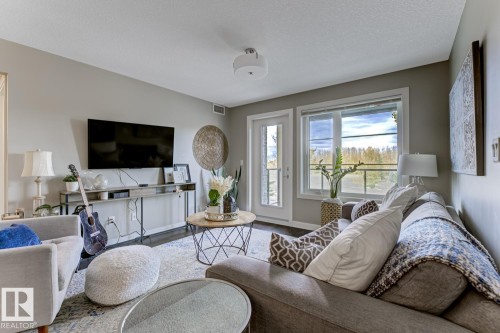 210 5029 Edgemont Boulevard, Edmonton, AB - Indoor Photo Showing Living Room