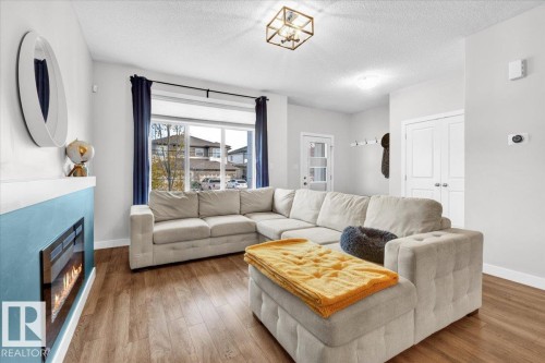 788 Berg Loop, Leduc, AB - Indoor Photo Showing Living Room With Fireplace