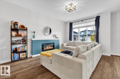 788 Berg Loop, Leduc, AB - Indoor Photo Showing Living Room With Fireplace