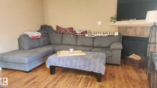 107 5420 Grant Macewan Boulevard, Leduc, AB - Indoor Photo Showing Other Room With Fireplace