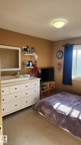107 5420 Grant Macewan Boulevard, Leduc, AB - Indoor Photo Showing Bedroom