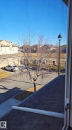 View of yard featuring a balcony - 