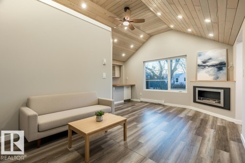 4713 48 Avenue, Wetaskiwin, AB - Indoor Photo Showing Living Room With Fireplace
