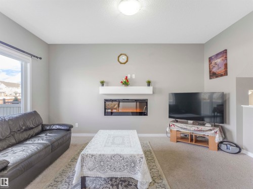 3565 Cherry Landing Landing, Edmonton, AB - Indoor Photo Showing Living Room With Fireplace