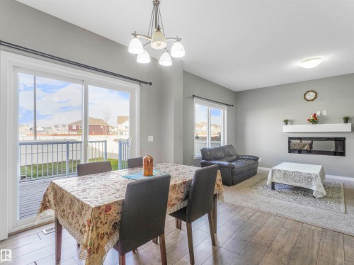 3565 Cherry Landing Landing, Edmonton, AB - Indoor Photo Showing Dining Room With Fireplace