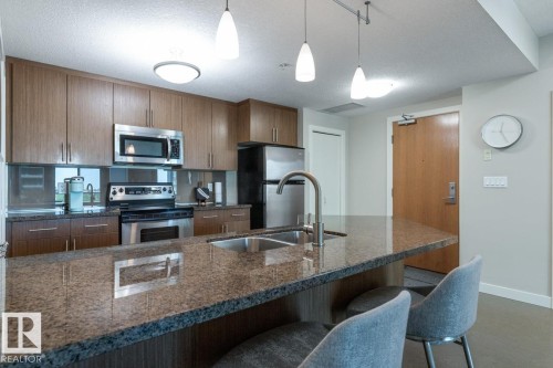 607 10055 118 Street, Edmonton, AB - Indoor Photo Showing Kitchen With Stainless Steel Kitchen With Double Sink