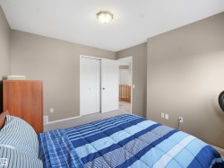 Carpeted bedroom featuring baseboards and a closet - 