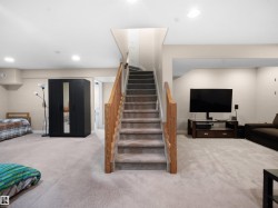 Staircase with carpet flooring and recessed lighting - 