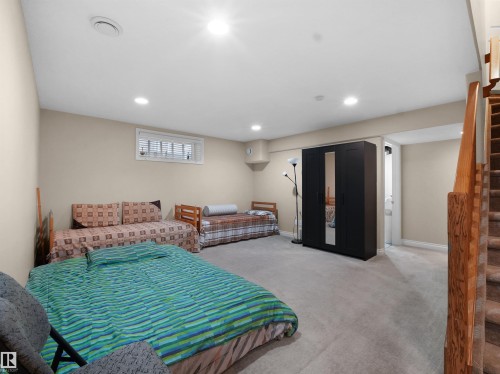 Carpeted bedroom featuring recessed lighting and access to exterior - 94 Dechene Road, Edmonton, AB - Indoor