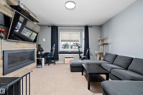 143 Acacia Circle, Leduc, AB - Indoor Photo Showing Living Room With Fireplace