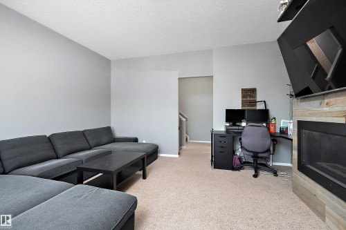 143 Acacia Circle, Leduc, AB - Indoor Photo Showing Other Room With Fireplace