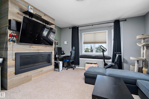 143 Acacia Circle, Leduc, AB - Indoor Photo Showing Living Room With Fireplace