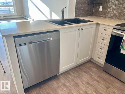 407 12804 140 Avenue, Edmonton, AB - Indoor Photo Showing Kitchen With Double Sink