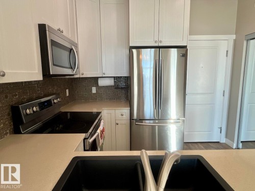 407 12804 140 Avenue, Edmonton, AB - Indoor Photo Showing Kitchen With Double Sink