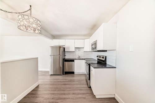417 8604 Gateway Boulevard, Edmonton, AB - Indoor Photo Showing Kitchen With Stainless Steel Kitchen
