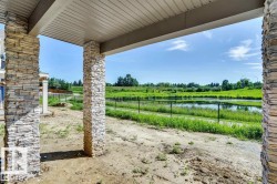 View of yard featuring a water view and a patio - 