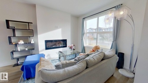 54 Sienna Boulevard, Fort Saskatchewan, AB - Indoor Photo Showing Living Room With Fireplace