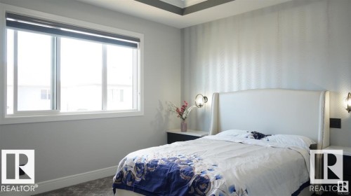 Carpeted bedroom with baseboards - 707 180 Street, Edmonton, AB - Indoor Photo Showing Bedroom