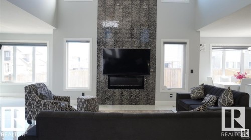 Living room featuring a fireplace - 707 180 Street, Edmonton, AB - Indoor Photo Showing Living Room