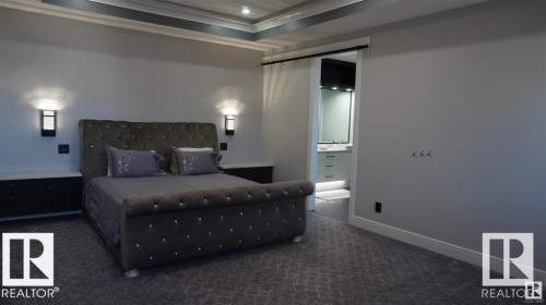 Carpeted bedroom with crown molding, ensuite bathroom, and recessed lighting - 707 180 Street, Edmonton, AB - Indoor Photo Showing Bedroom