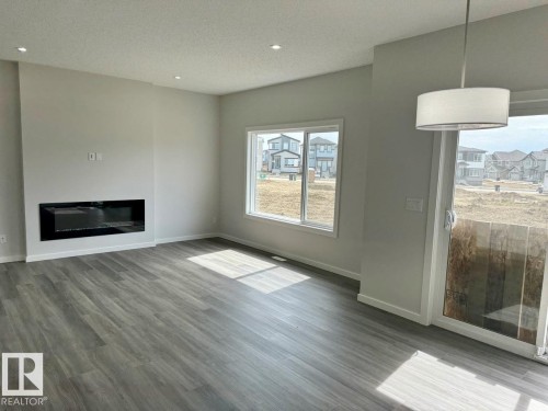 Upper 319 33 Avenue, Edmonton, AB - Indoor Photo Showing Living Room With Fireplace