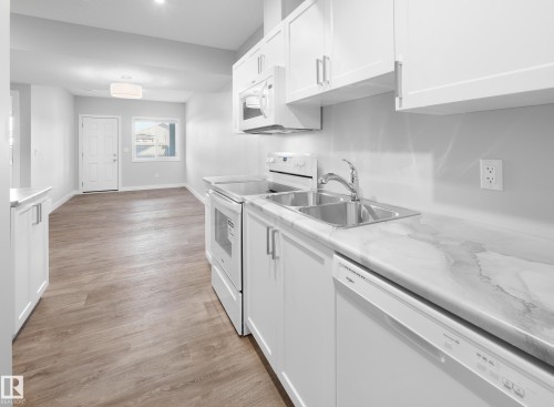 752 Berg Loop, Leduc, AB - Indoor Photo Showing Kitchen With Double Sink