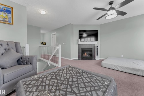 1651 28 Street, Edmonton, AB - Indoor Photo Showing Bedroom With Fireplace
