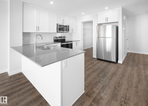 760 Berg Loop, Leduc, AB - Indoor Photo Showing Kitchen With Double Sink With Upgraded Kitchen