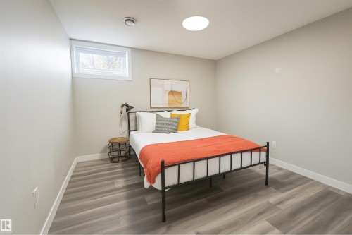 Bedroom featuring wood finished floors and baseboards - 4203 83 Street, Edmonton, AB - Indoor Photo Showing Bedroom