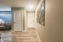 Corridor with light wood-style floors and baseboards - 4203 83 Street, Edmonton, AB  - Indoor Photo Showing Other Room 